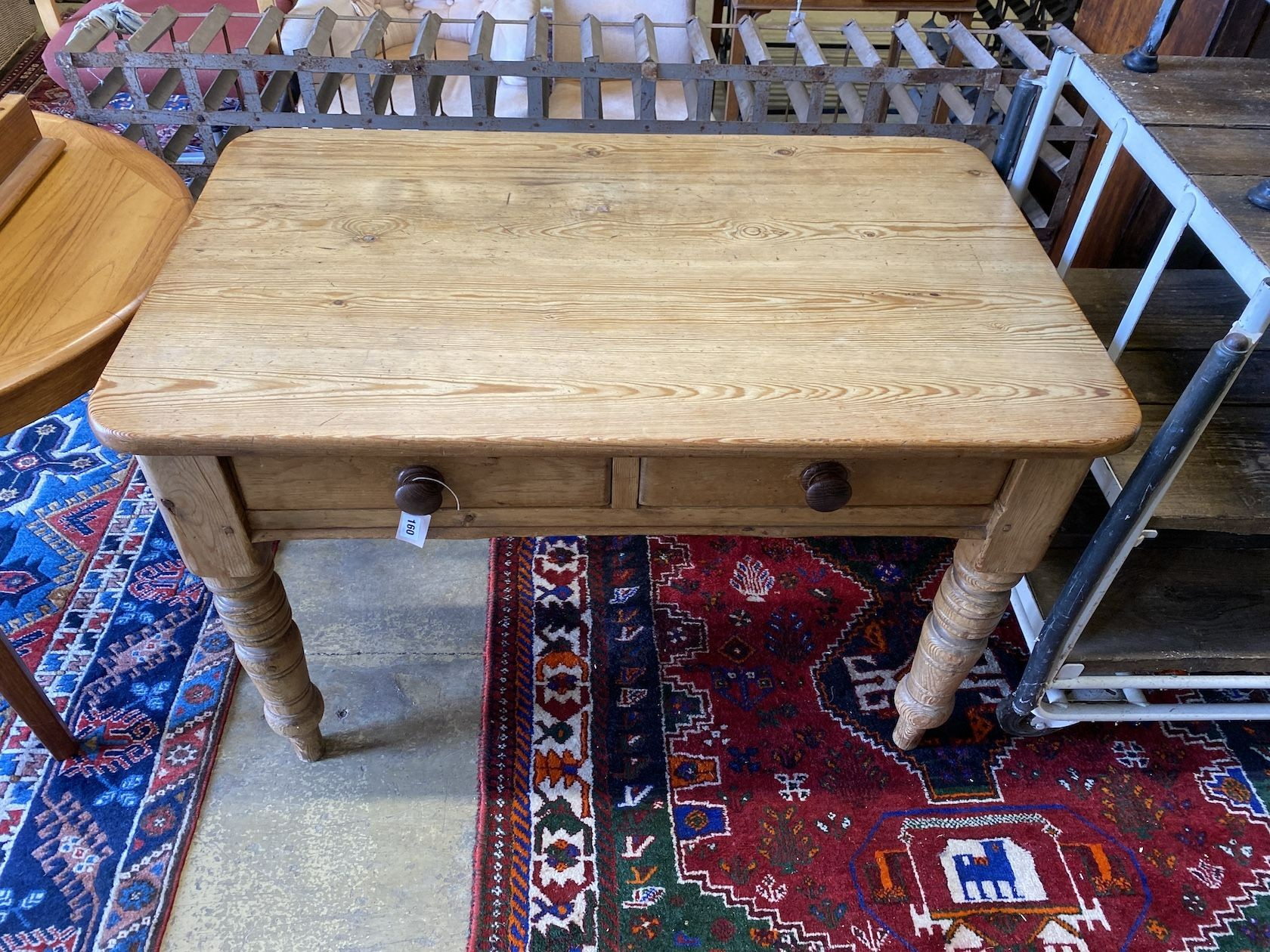 A Victorian pitch pine two drawer kitchen table, width 118cm, depth 42cm, height 78cm